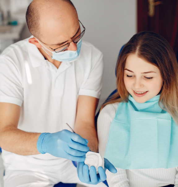 A beautiful girl sitting in dentist's office