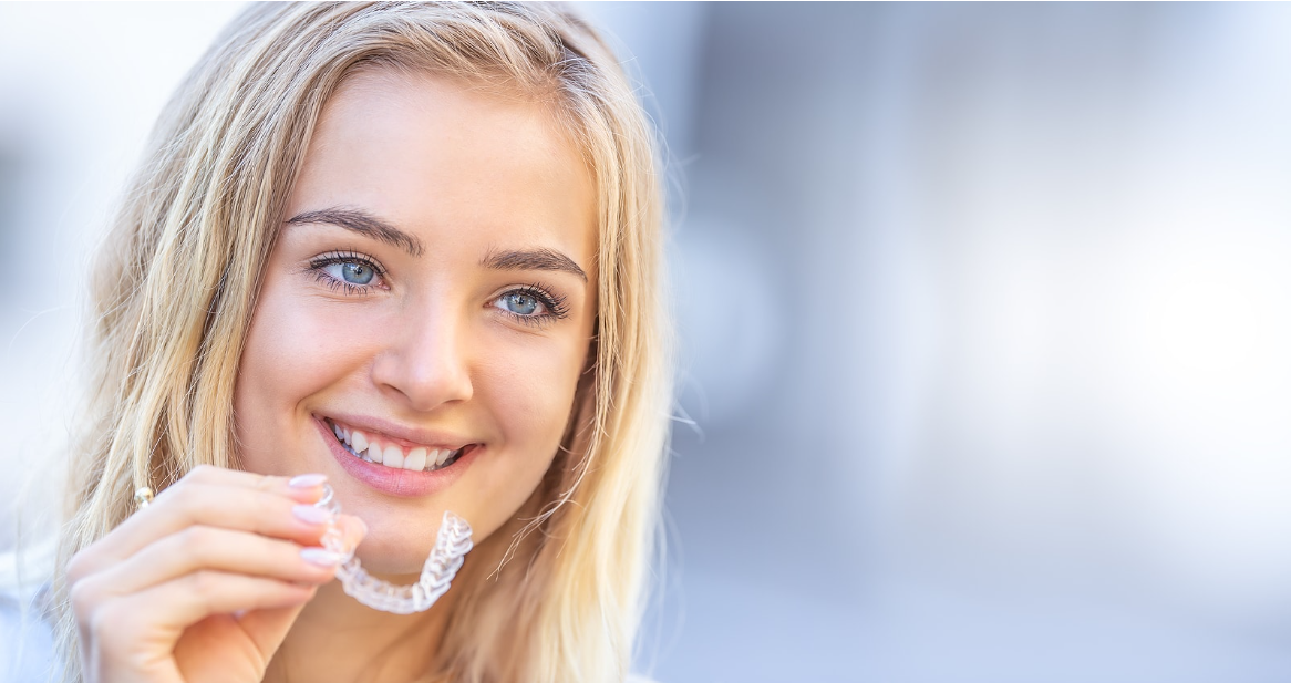 A beautiful teen wearing her Invisalign clear aligners