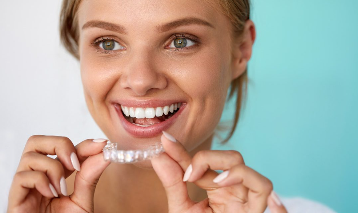A beautiful woman wearing her Invisalign clear aligners