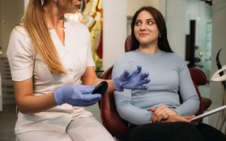 A dentist counseling her patient about the Invisalign