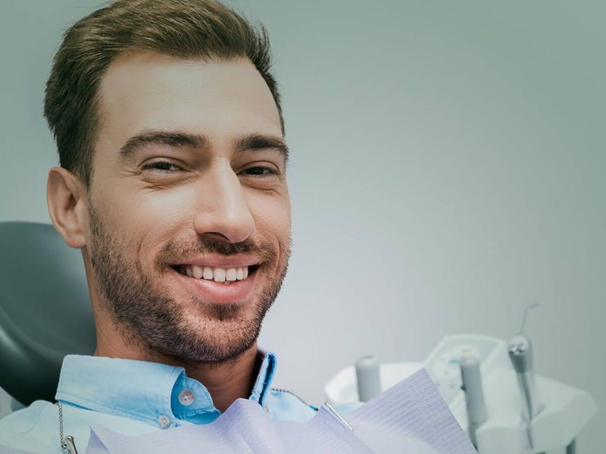 A patient with ozone treatment near him is getting ready for ozone treatment for his teeth
