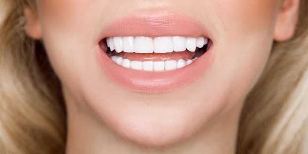  A Smiling Face With Beautiful White Teeth.