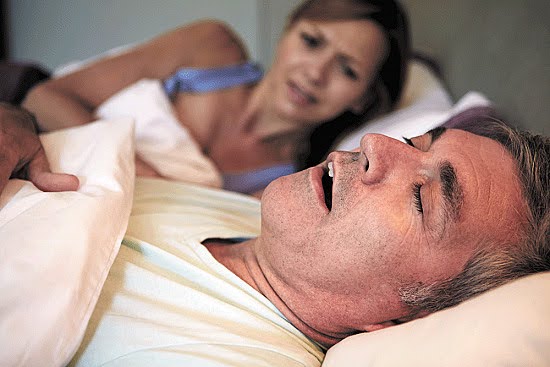 A Man Snoring Loudly because of obstructive sleep apnea Keeping His Bed Partner From Good Rest A Man Snoring Loudly because of obstructive sleep apnea Keeping His Bed Partner From Good Rest
