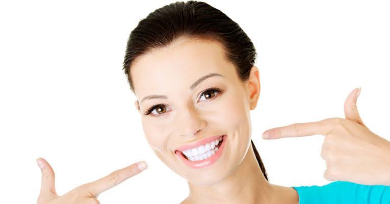   A beautiful girl showing her beautiful, charismatic smile after ozone dental treatment