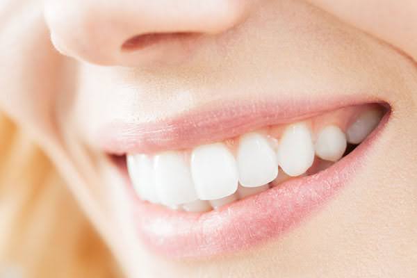  A beautiful, charismatic smile with white teeth after ozone dental treatment