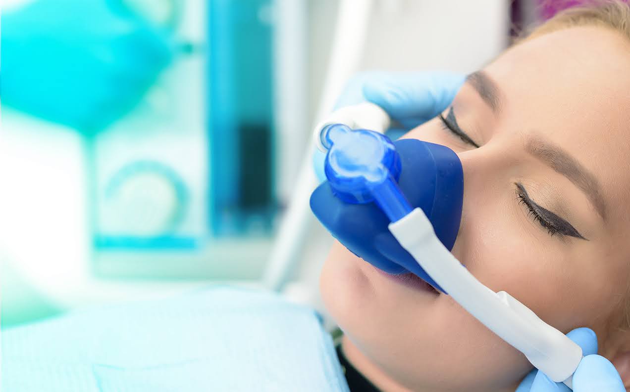 Nitrous oxide easing a patient's mind for her dental work Nitrous oxide easing a patient's mind for her dental work